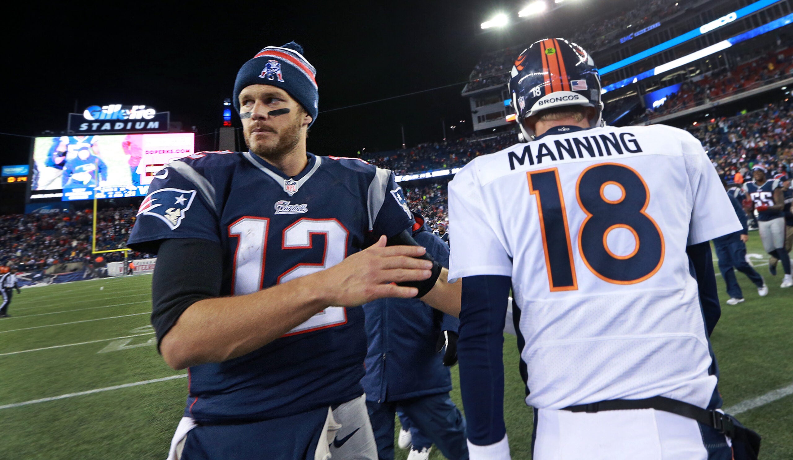 As the final 15 seconds tick off the clock, Broncos quarterback Peyton Manning (left) and Tom Brady (right) meet quickly, shook hands even quicker and then they seperated. The New England Patriots hosted the Denver Broncos in a regular season NFL game at Gillete Stadium.